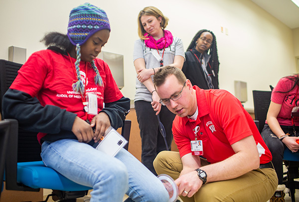 A student interacts with a teenager as part of the curriculum