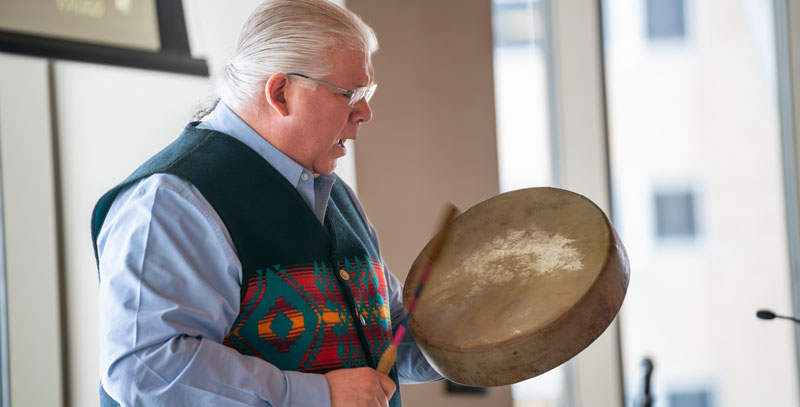 Bret Benally Thompson playing a drum