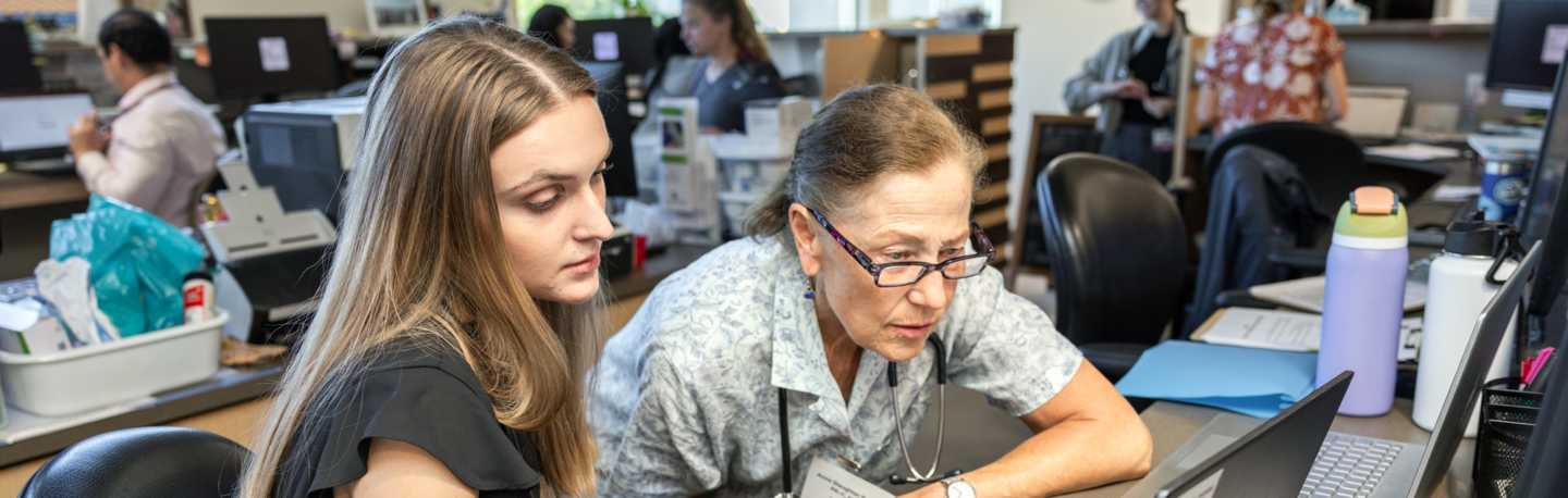 Anne Slaughter Perrote works with a PA student