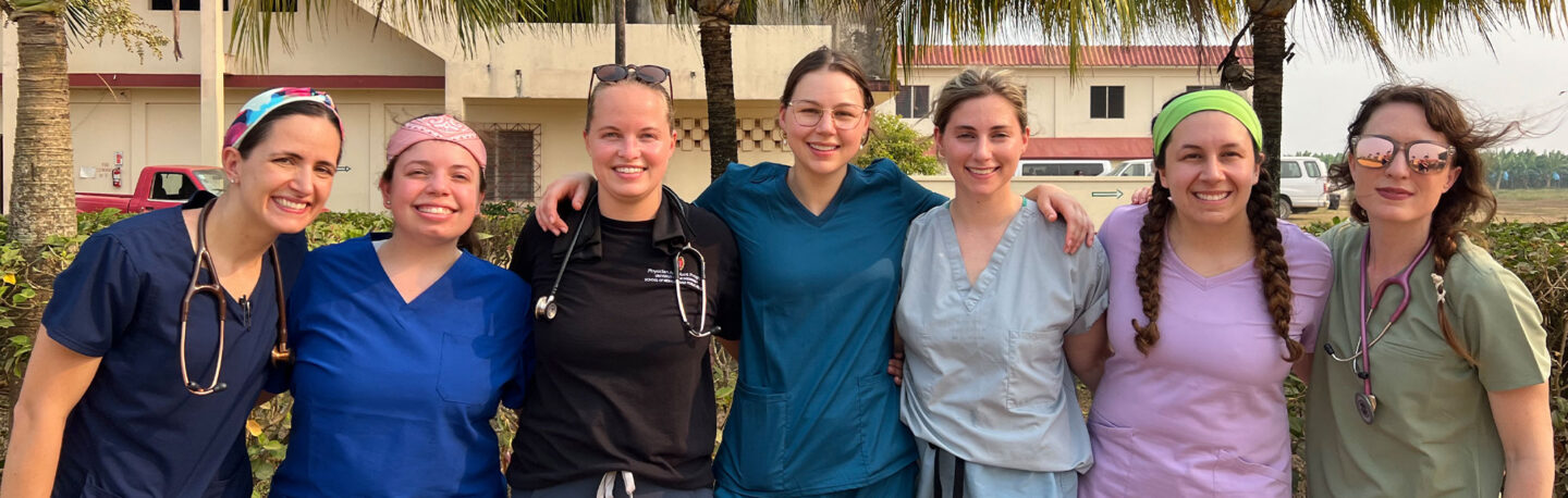 Group of smiling health professions students on service-learning trip to Belize
