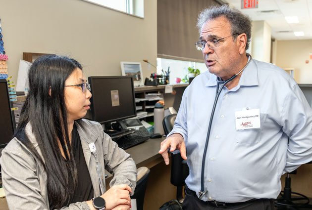 Dr. Jean Montgomery talks with a MEDiC volunteer