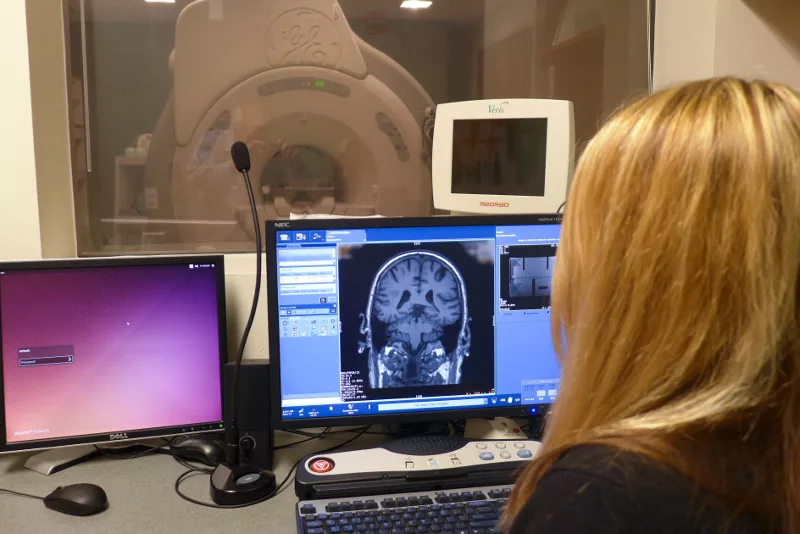 Sara John, MRI research technologist, looking at brain images